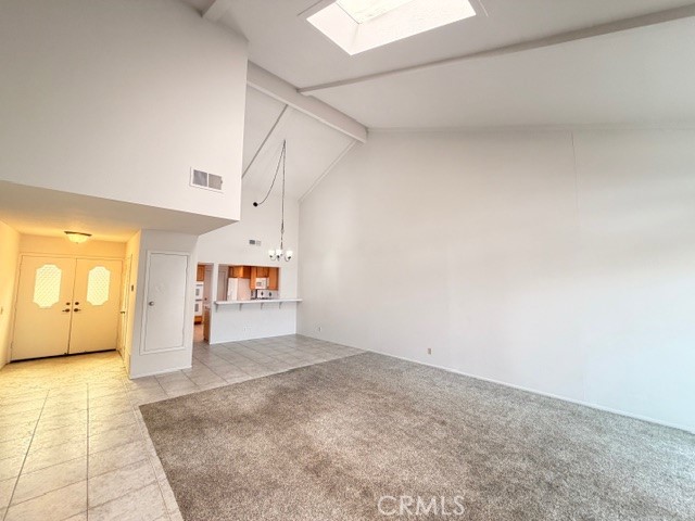 1022 Regis Way Tustin, CA 92780 - Photo 7 of 43 Open concept Living room with a skylight