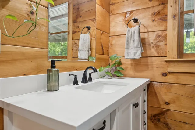 a bathroom with a sink and a mirror