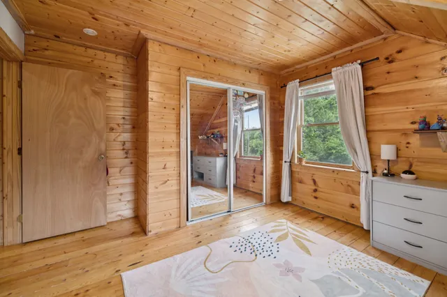 a bathroom with a sink a mirror and shower