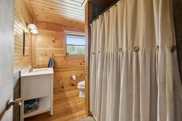a view of a balcony with wooden floor