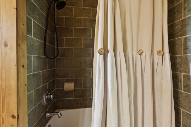 a view of balcony with wooden floor and outdoor seating