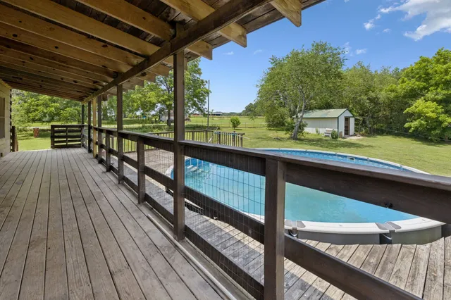 a view of a swimming pool with a patio