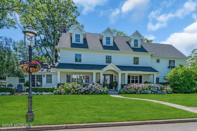 12 Red Oak Drive Spring Lake, NJ 07762 - Photo 2 of 79 a front view of a house with a yard