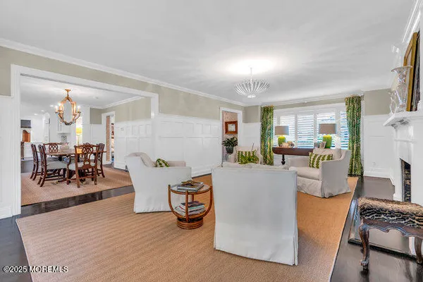 a living room with furniture a fireplace and a table