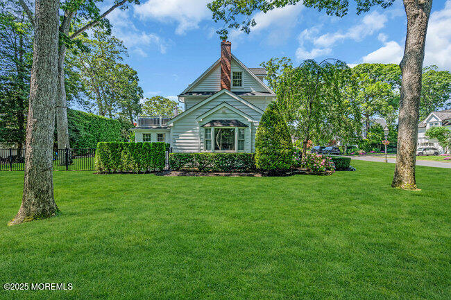 12 Red Oak Drive Spring Lake, NJ 07762 - Photo 22 of 79 a front view of a house with a garden