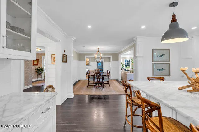 a living room with furniture a fireplace and a table
