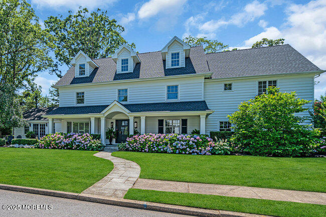 12 Red Oak Drive Spring Lake, NJ 07762 - Photo 3 of 79 a front view of a house with a garden