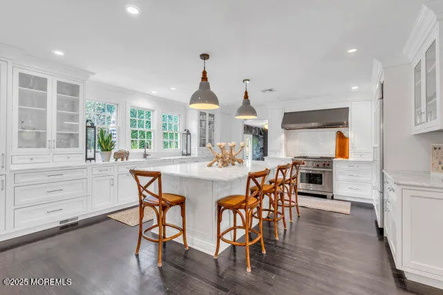 a living room with furniture a fireplace and a table