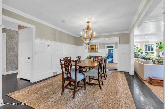 a spacious bedroom with a bed and a flat screen tv