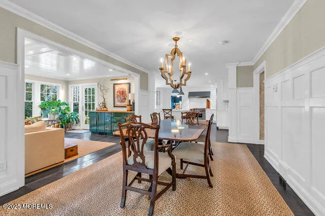 a bedroom with a bed and a flat tv screen on the table