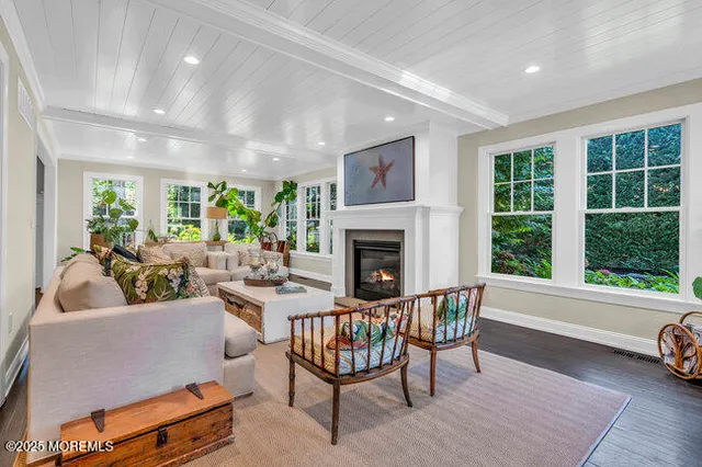 a bathroom with a granite countertop sink a mirror and a shower