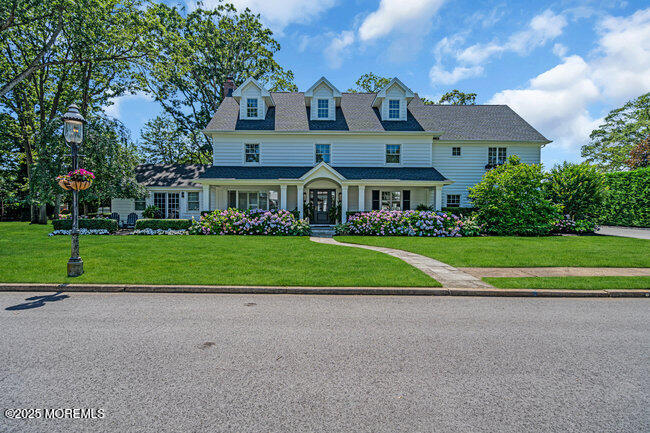 12 Red Oak Drive Spring Lake, NJ 07762 - Photo 5 of 79 a front view of house with yard and green space