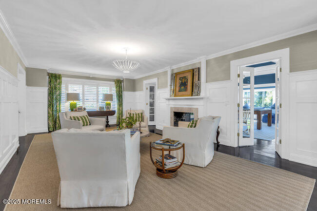 12 Red Oak Drive Spring Lake, NJ 07762 - Photo 51 of 79 a living room with furniture a fireplace and a table