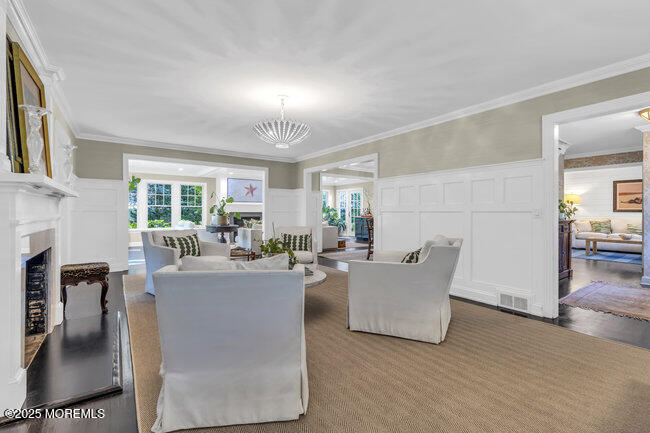 12 Red Oak Drive Spring Lake, NJ 07762 - Photo 53 of 79 a living room with furniture a fireplace and a table
