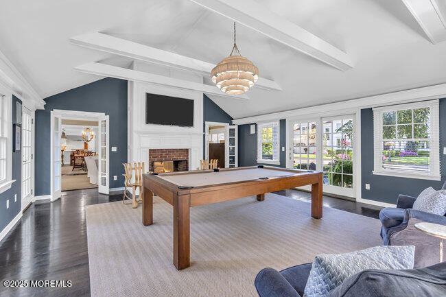 12 Red Oak Drive Spring Lake, NJ 07762 - Photo 55 of 79 a living room with furniture a fireplace and a flat screen tv