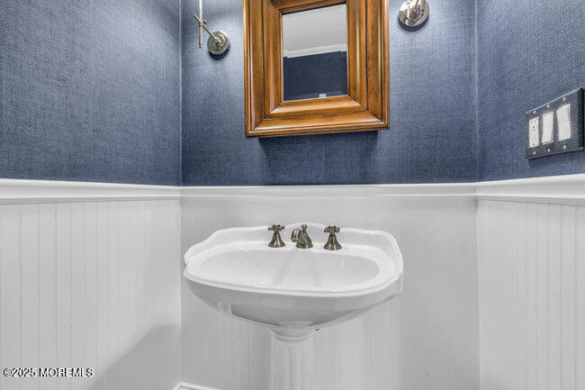 12 Red Oak Drive Spring Lake, NJ 07762 - Photo 58 of 79 a bathroom with a sink and a mirror