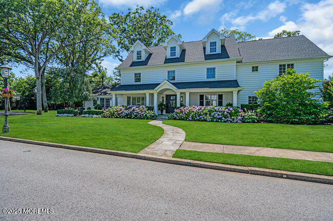 12 Red Oak Drive Spring Lake, NJ 07762 - Photo 6 of 79 a front view of house with yard and green space