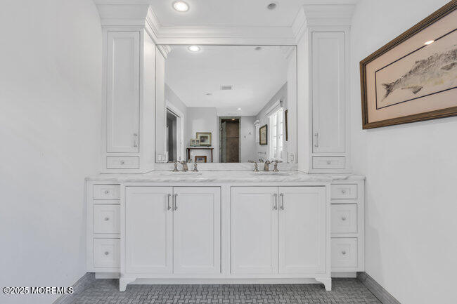 12 Red Oak Drive Spring Lake, NJ 07762 - Photo 67 of 79 a bathroom with a double vanity sink and a mirror