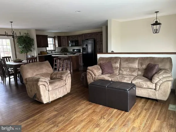a bedroom with a bed and a potted plant