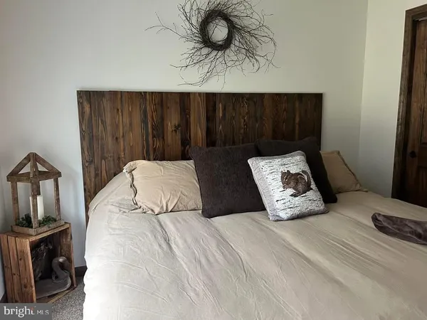 a bathroom with a sink a toilet and a window