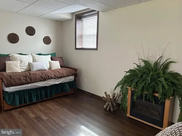 a bedroom with a bunk bed and a window