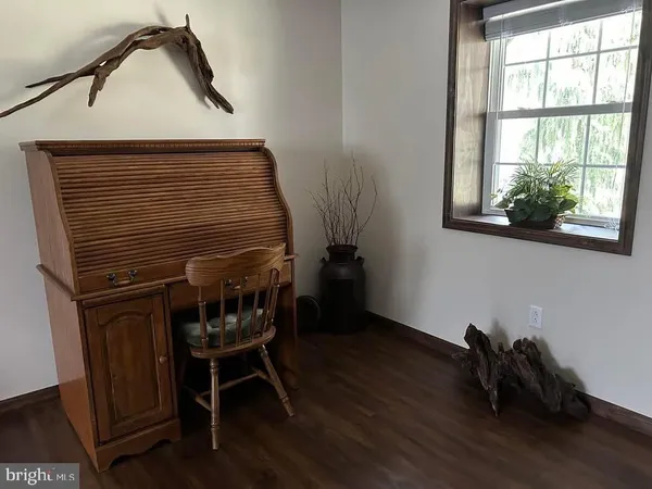 a living room with furniture and a yard