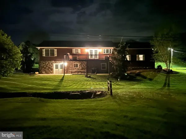 a view of a house with a big yard