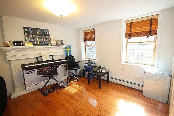 208 3rd Street Hoboken, NJ 07030 - Photo 18 of 22 a view of a workspace with furniture and a window