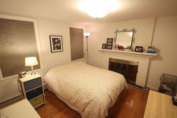 208 3rd Street Hoboken, NJ 07030 - Photo 19 of 22 a bedroom with a bed and a mirror