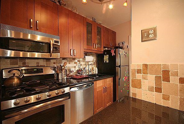 208 3rd Street Hoboken, NJ 07030 - Photo 5 of 22 a kitchen with stainless steel appliances a sink stove and microwave
