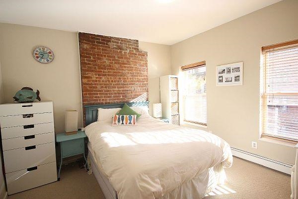 208 3rd Street Hoboken, NJ 07030 - Photo 8 of 22 a bedroom with a bed and a window