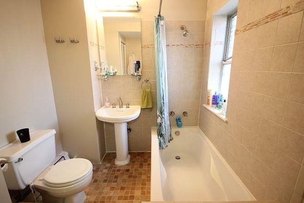 208 3rd Street Hoboken, NJ 07030 - Photo 9 of 22 a bathroom with a sink a toilet and shower