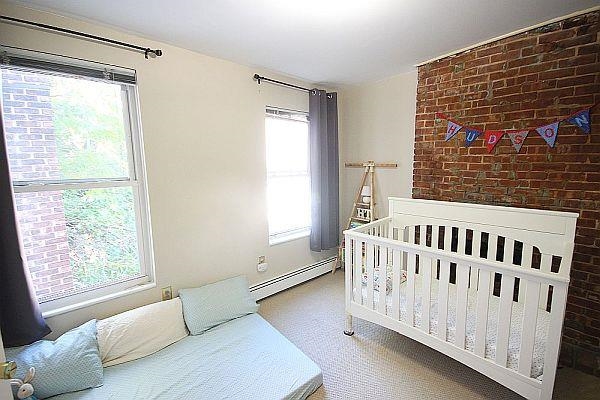 208 3rd Street Hoboken, NJ 07030 - Photo 10 of 22 a view of a bedroom with furniture and windows