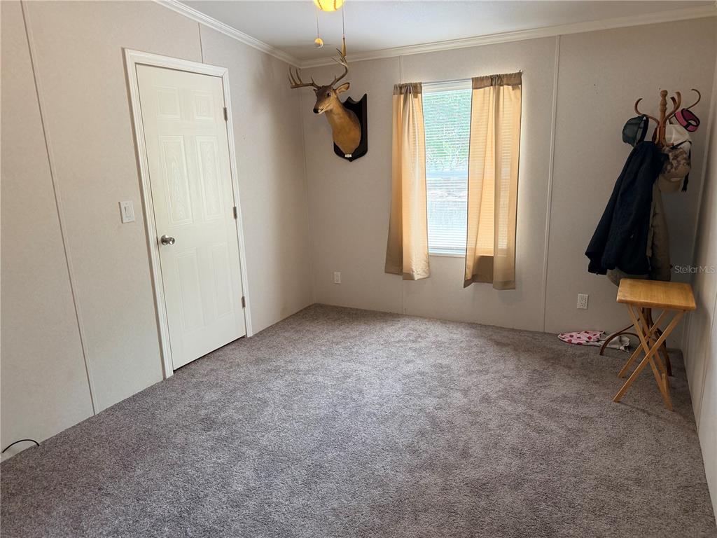 33 Ridge Road Frostproof, FL 33843 - Photo 7 of 21 a view of an empty room with a window