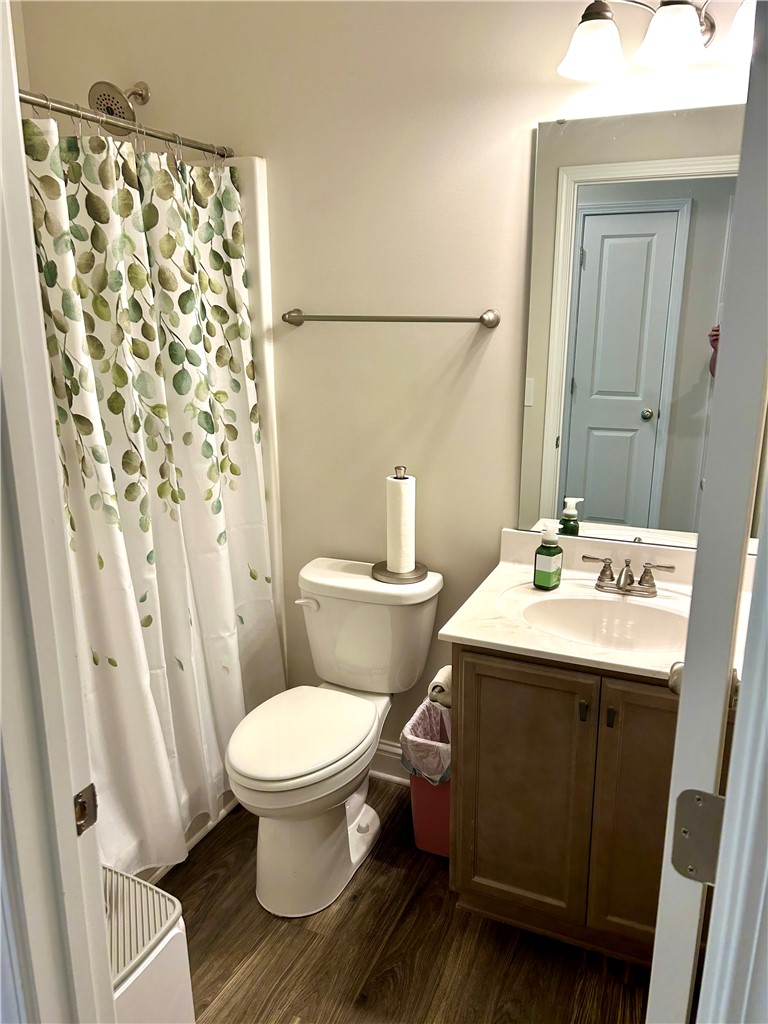 170 Capslock Trail Pendleton, SC 29670 - Photo 16 of 22 Rich wood flooring pairs elegantly with a stone-counter vanity in this classic full bathroom.