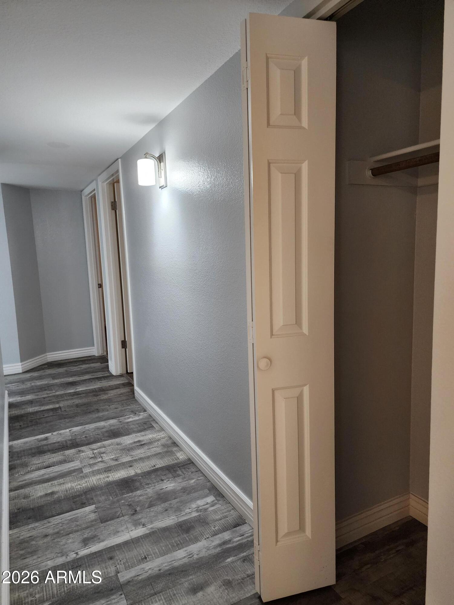 8708 West Ruth Avenue Peoria, AZ 85345 - Photo 27 of 28 Hallway to bdrms has coat closet
