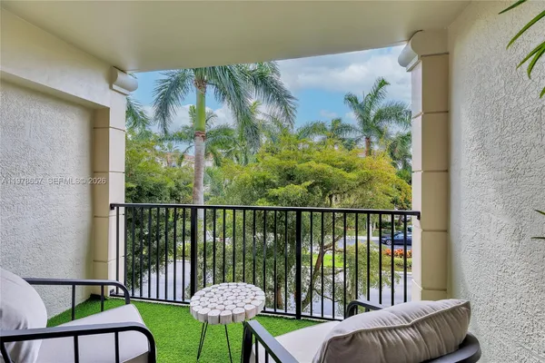 a view of a balcony with chairs