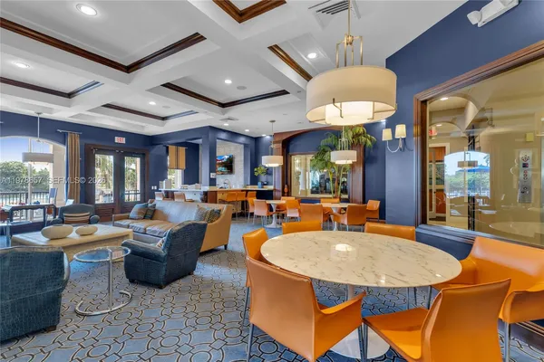 a living room with fireplace furniture and a large window