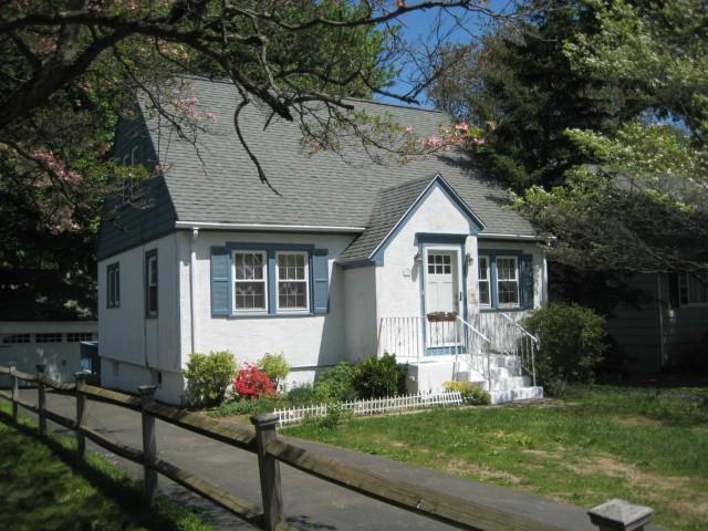 1586 Stratfield Road Fairfield, CT 06825 - Photo 1 of 1 a front view of house with yard and green space