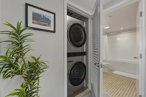 a view of a hallway with washer and dryer