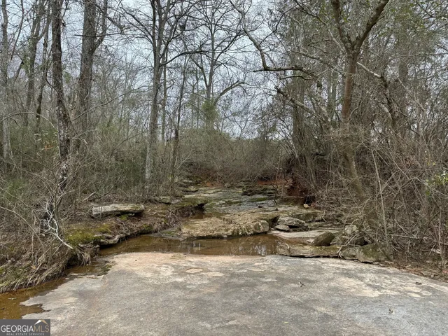 a kitchen with a sink and a stove top oven