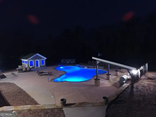 a room with furniture pool table gym equipment and a mirror