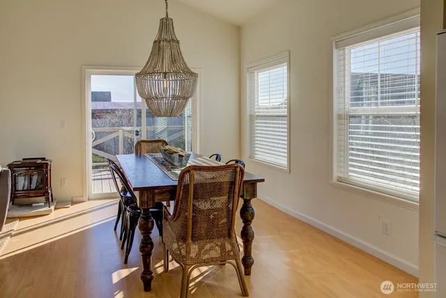 a dining room with furniture and window