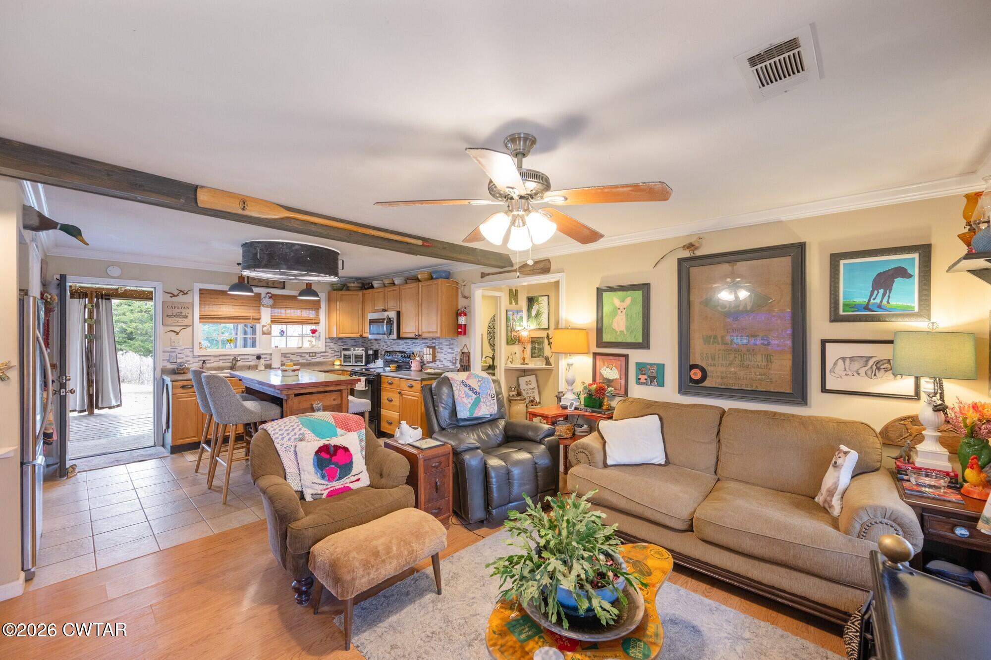 2108 Bohannon Landing Road Sugar Tree, TN 38380 - Photo 13 of 57 a living room with furniture kitchen and a table