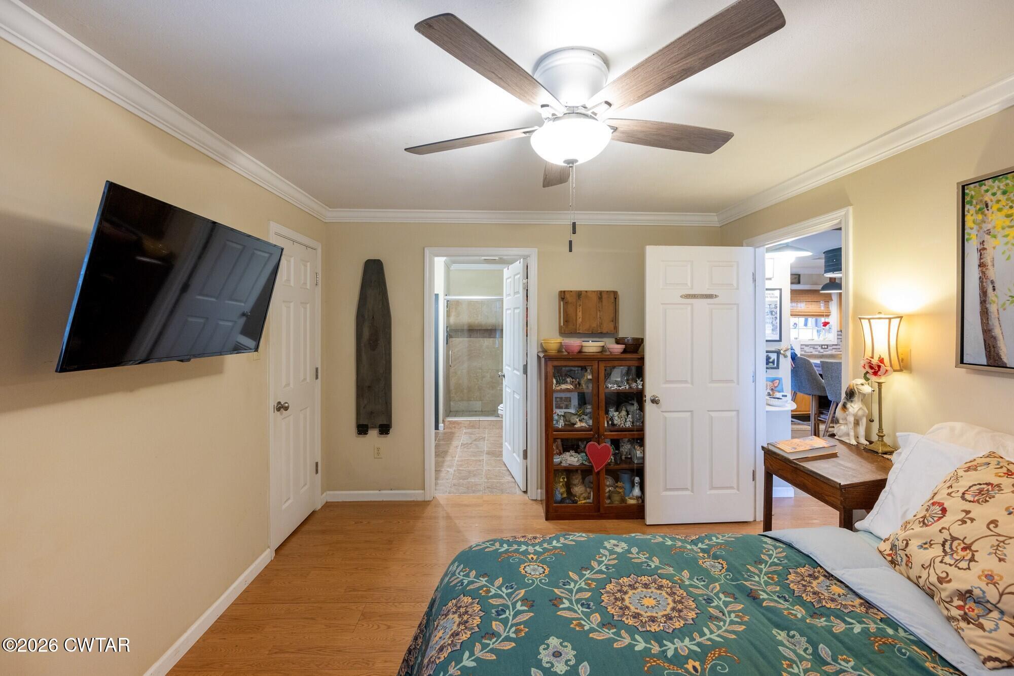2108 Bohannon Landing Road Sugar Tree, TN 38380 - Photo 16 of 57 a living room with furniture and a flat screen tv