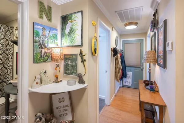 a bedroom with furniture and a book shelf