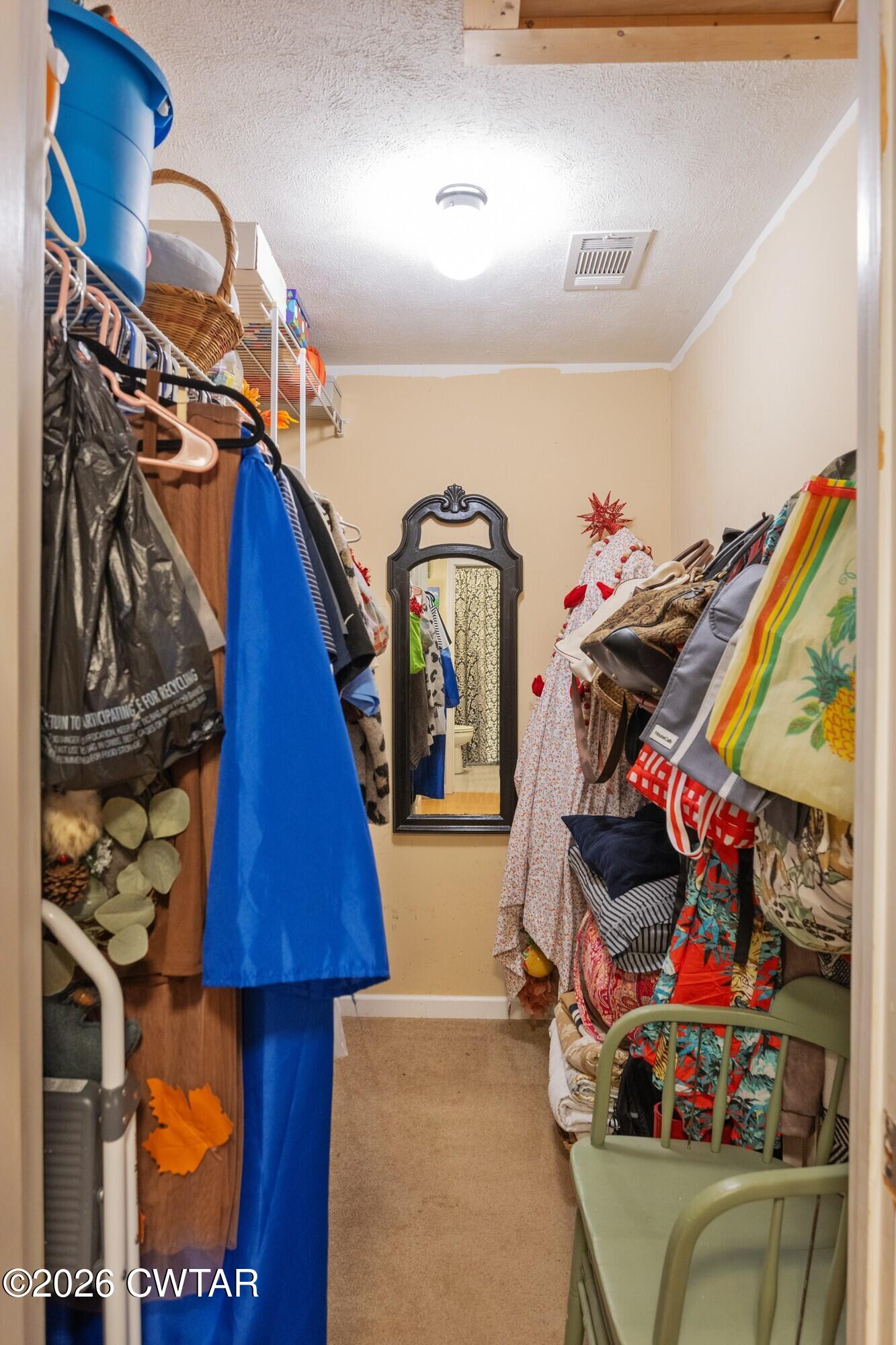 2108 Bohannon Landing Road Sugar Tree, TN 38380 - Photo 22 of 57 a view of walk in closet with clothes and shoes