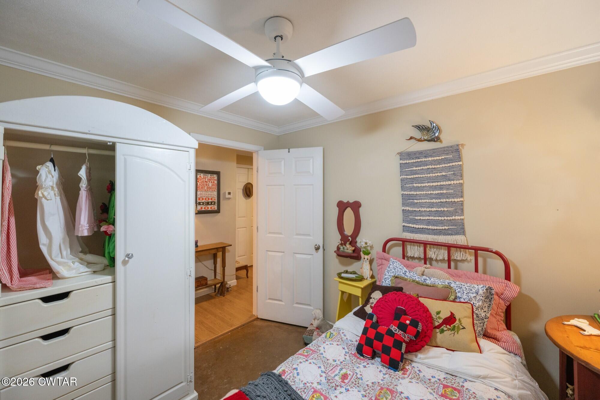2108 Bohannon Landing Road Sugar Tree, TN 38380 - Photo 25 of 57 a bedroom with a bed and wooden floor