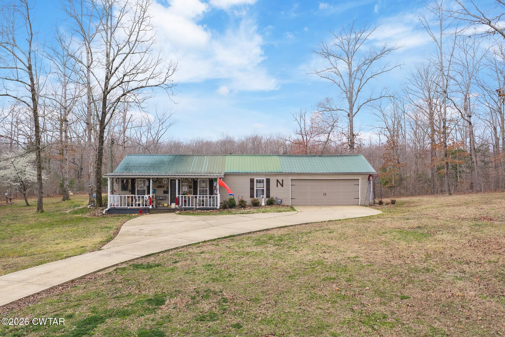 2108 Bohannon Landing Road Sugar Tree, TN 38380 - Photo 3 of 57 a front view of house with yard and trees around