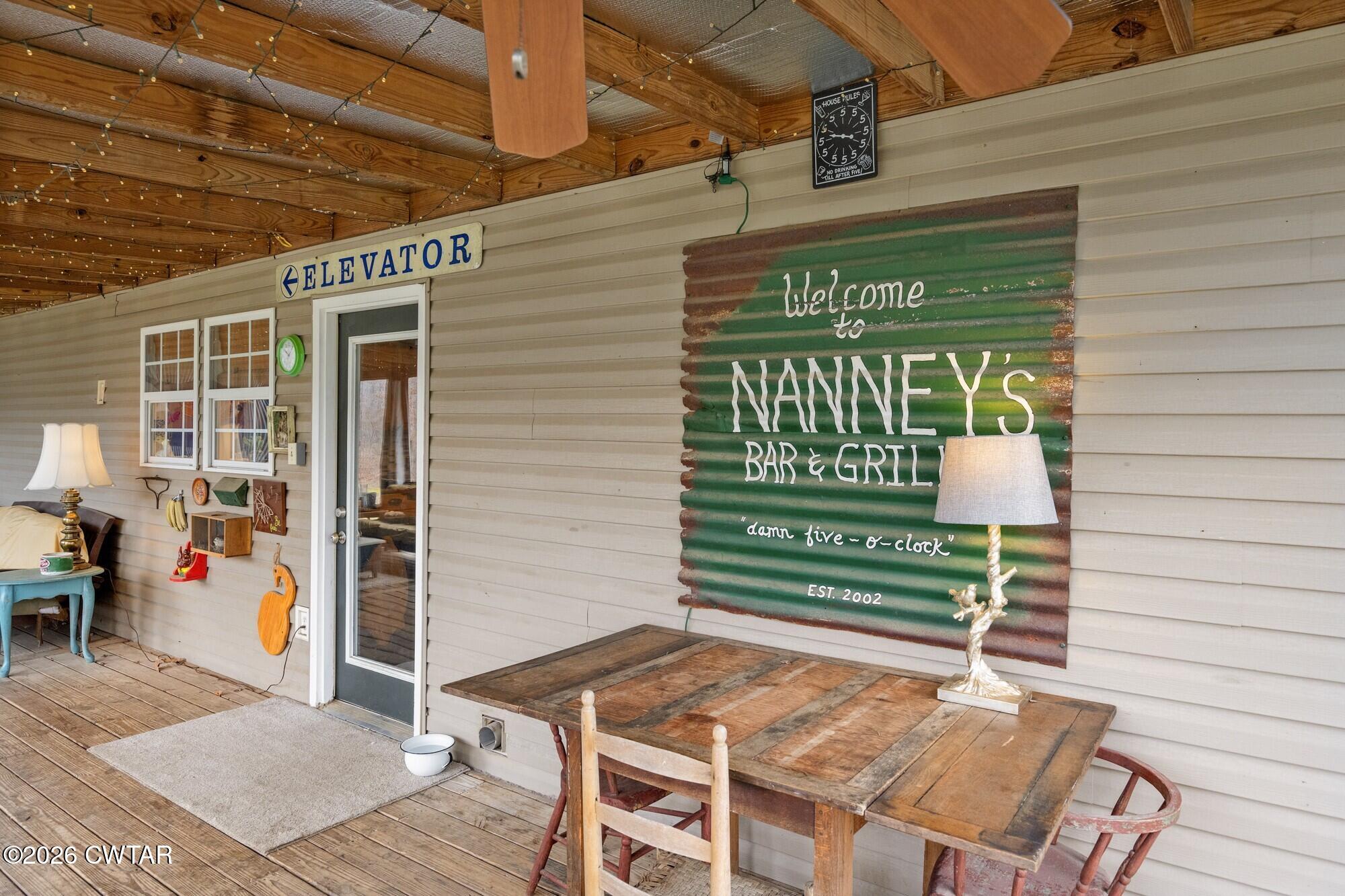 2108 Bohannon Landing Road Sugar Tree, TN 38380 - Photo 31 of 57 a backyard of a house with barbeque oven table and chairs